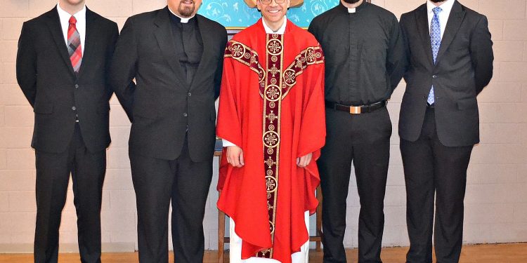 Rev. Craig Best with seminarians that attended his First Mass of Thanksgiving. (CT Photo/Greg Hartman)