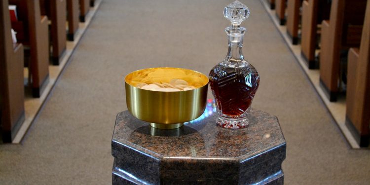 Gifts of bread and wine at St. Antoninus Parish. (CT Photo/Greg Hartman)