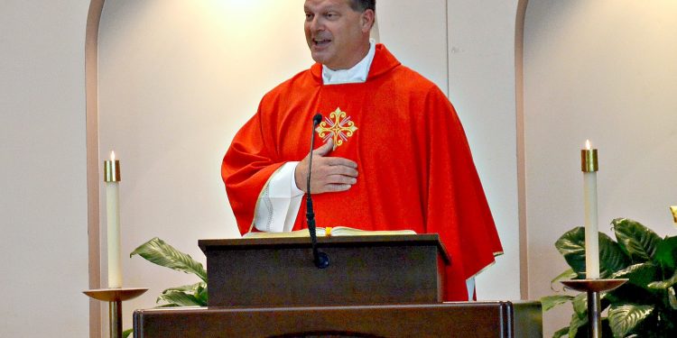 Rev. Anthony Brausch gives the homily at Rev. Jacob Willig's First Mass of Thanksgiving. (CT Photo/Greg Hartman)