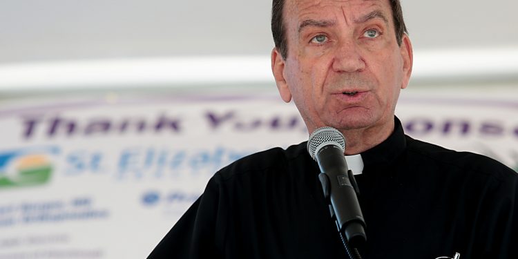 Archbishop Dennis Schnurr speaks and gives a blessing during the Cross the Bridge for Life celebration on Riverboat Row in Newport. Sunday, June 3, 2018. (CT Photo/E.L. Hubbard)