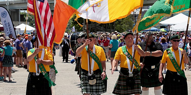 The Ancient Order of Hibernians Color Guard leads the procession during the Cross the Bridge for Life celebration on Riverboat Row in Newport, Sunday, June 3, 2018. (CT Photo/E.L. Hubbard)