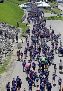 People head to the Purple People Bridge during the Cross the Bridge for Life celebration on Riverboat Row in Newport, Sunday, June 3, 2018. (CT Photo/E.L. Hubbard)