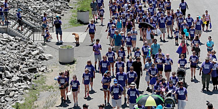 People head to the Purple People Bridge during the Cross the Bridge for Life celebration on Riverboat Row in Newport, Sunday, June 3, 2018. (CT Photo/E.L. Hubbard)