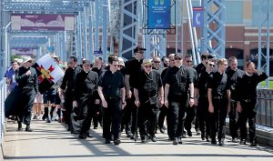 Priests from the Diocese of Covington and Archdiocese of Cincinnati cross the Purple People Bridge during the Cross the Bridge for Life celebration on Riverboat Row in Newport, Sunday, June 3, 2018. (CT Photo/E.L. Hubbard)