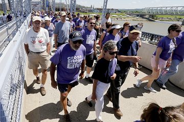 Thousands cross the Purple People Bridge during the Cross the Bridge for Life celebration on Riverboat Row in Newport, Sunday, June 3, 2018. (CT Photo/E.L. Hubbard)