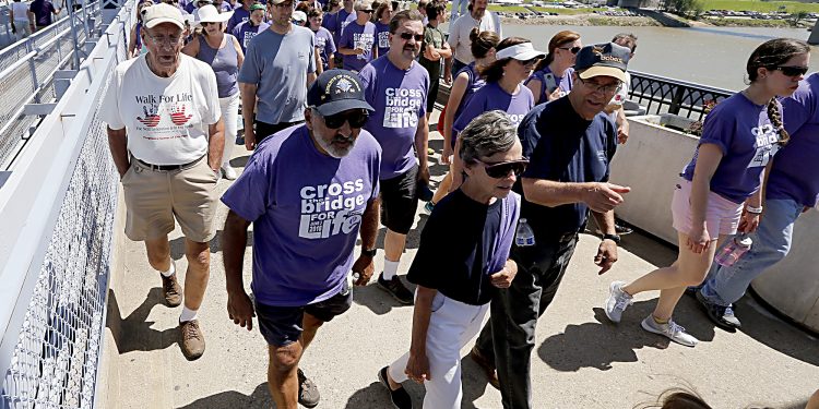 Thousands cross the Purple People Bridge during the Cross the Bridge for Life celebration on Riverboat Row in Newport, Sunday, June 3, 2018. (CT Photo/E.L. Hubbard)