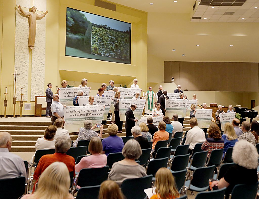 Awarded communities stand with their banners during the first annual Laudato Si’ Community recognitions ceremony at Good Shepherd Church in Cincinnati Monday, June 18, 2018. (CT Photo/E.L. Hubbard)