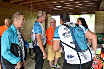 Cyclist just completing their 250 mile ride share stories of the road at the Hausfeld ND2UD Ride for Dayton Right to Life (CT Photo/Greg Hartman)