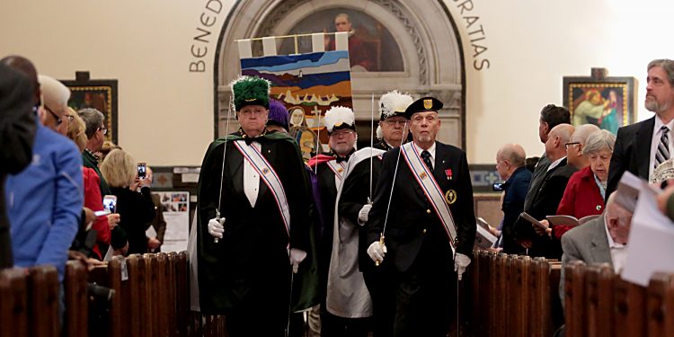 The Knights of Columbus lead the processional for the Mass of Thanksgiving for the 150th Anniversary of the Arrival of the Little Sisters of the Poor in Cincinnati at St. Monica-St. George Parish in Cincinnati Saturday, Oct. 20, 2018. (CT Photo/E.L. Hubbard)