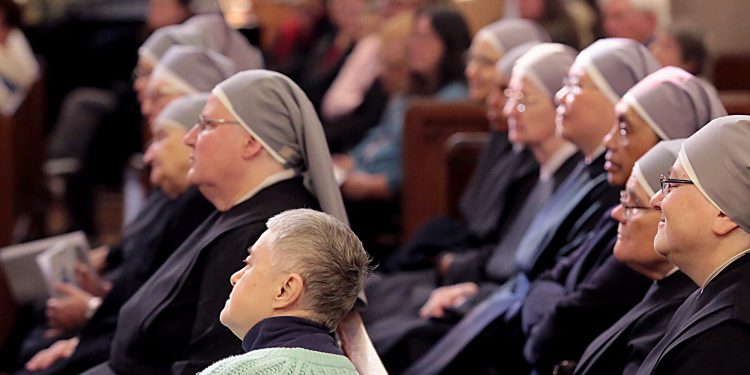 Little Sisters of the Poor listen to Archbishop Dennis Schnurr’s Homily for the Mass of Thanksgiving for the 150th Anniversary of the Arrival of the Little Sisters of the Poor in Cincinnati at St. Monica-St. George Parish in Cincinnati Saturday, Oct. 20, 2018. (CT Photo/E.L. Hubbard)