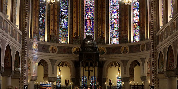 Archbishop Dennis Schnurr prepares the Holy Eucharist for the Mass of Thanksgiving for the 150th Anniversary of the Arrival of the Little Sisters of the Poor in Cincinnati at St. Monica-St. George Parish in Cincinnati Saturday, Oct. 20, 2018. (CT Photo/E.L. Hubbard)