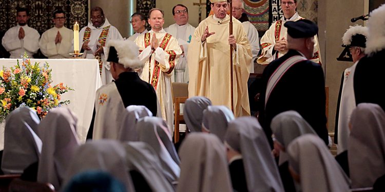 Archbishop Dennis Schnurr thanks, and congratulates, the Sisters after the Mass of Thanksgiving for the 150th Anniversary of the Arrival of the Little Sisters of the Poor in Cincinnati at St. Monica-St. George Parish in Cincinnati Saturday, Oct. 20, 2018. (CT Photo/E.L. Hubbard)