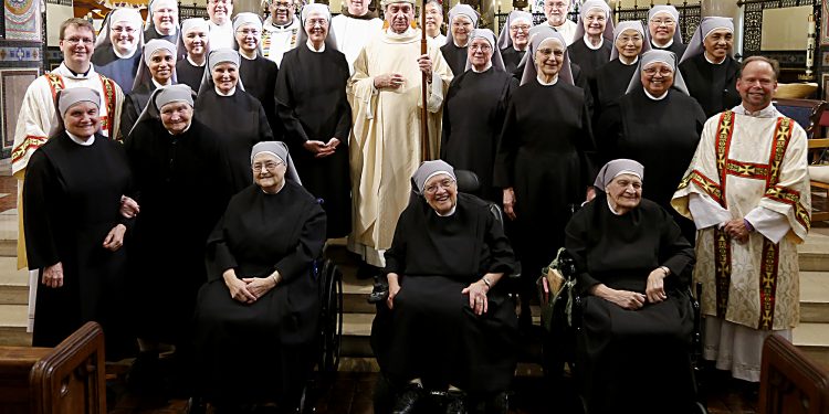 Archbishop Dennis Schnurr and Little Sisters of the Poor after the Mass of Thanksgiving for the 150th Anniversary of the Arrival of the Little Sisters of the Poor in Cincinnati at St. Monica-St. George Parish in Cincinnati Saturday, Oct. 20, 2018. (CT Photo/E.L. Hubbard)