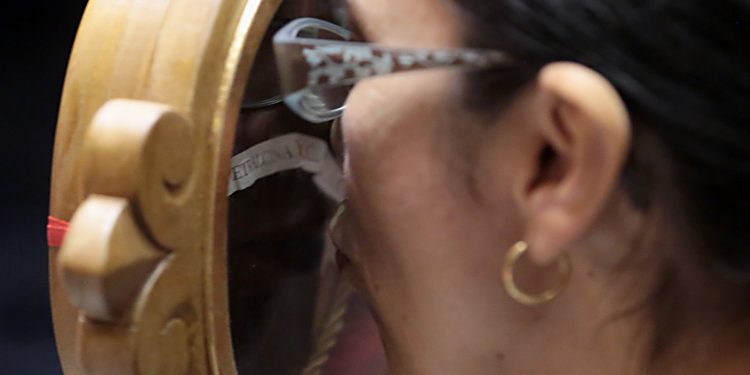 A woman kisses a relic of Saint Pio of Pietrelcine, O.F.M Cap, at Saint Peter in Chains Cathedral in Cincinnati Wednesday, Oct. 3, 2018. (CT Photo/E.L. Hubbard)