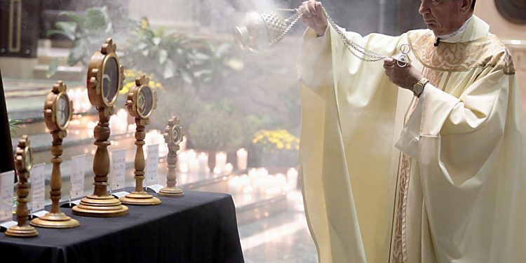 Archbishop Dennis Schnurr censes the relics of Saint Pio of Pietrelcine, O.F.M Cap, at Saint Peter in Chains Cathedral in Cincinnati Wednesday, Oct. 3, 2018. (CT Photo/E.L. Hubbard)