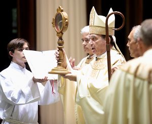 Holding a Relic, Archbishop Dennis Schnurr offers the Final Blessing during Mass and Veneration of the Relics of Saint Pio of Pietrelcine, O.F.M Cap, at Saint Peter in Chains Cathedral in Cincinnati Wednesday, Oct. 3, 2018. (CT Photo/E.L. Hubbard)