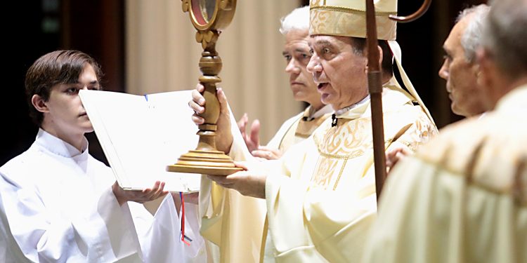 Holding a Relic, Archbishop Dennis Schnurr offers the Final Blessing during Mass and Veneration of the Relics of Saint Pio of Pietrelcine, O.F.M Cap, at Saint Peter in Chains Cathedral in Cincinnati Wednesday, Oct. 3, 2018. (CT Photo/E.L. Hubbard)