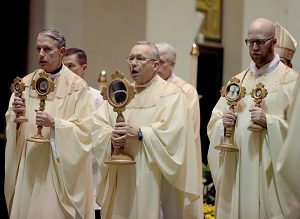 Fr. Raymond Larger, Fr. Jan Schmidt, and Fr. Kyle Schnippel carry the Relics during Mass and Veneration of the Relics of Saint Pio of Pietrelcine, O.F.M Cap, at Saint Peter in Chains Cathedral in Cincinnati Wednesday, Oct. 3, 2018. (CT Photo/E.L. Hubbard)