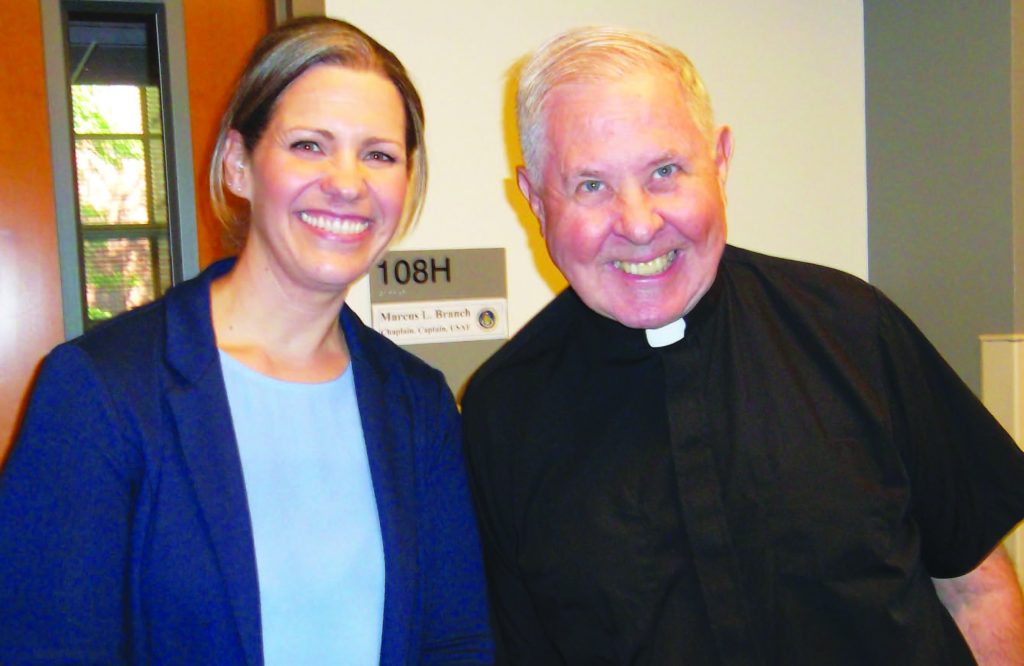 Cheri Champagne, Catholic coordinator at Our Lady Queen of Peace Parish on Wright-Patterson AFB, poses with Father Donald Moss, pastor. (Courtesy Photo)