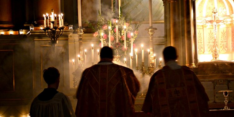 The night is advanced, the day is at hand. Let us then throw off the works of darkness [and] put on the armor of light Romans 13:12 Rorate Mass Old St Mary (CT Photo/Greg Hartman)