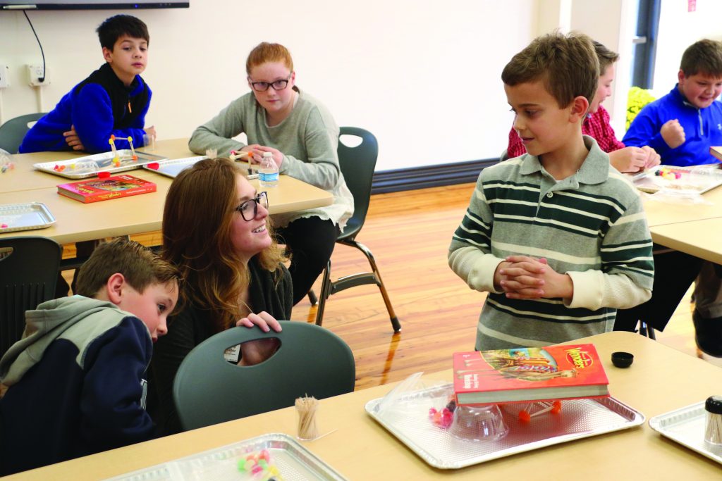 Nativity teacher Olivia Wolber oversees students working in the STEAM lab. (Courtesy Photo)