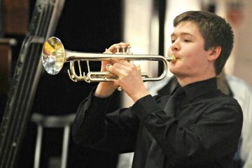 La Salle senior Nathaniel Behr plays "Taps" at the end of the school's 5th Annual Veteran Appreciation Day on Tuesday, Feb. 12. The program featured a presentation of the "Missing Man Ceremony," music and a keynote address by St. Ursula High School graduate United States Air Force Lt. Col. Angela F. Ochoa (CT Photo/David Moodie)