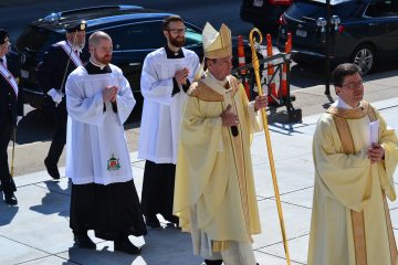 Deacon Mark Machuga, Director of the Permanent Diaconate Office, and Archbishop Dennis M. Schnurr process at the Ordination of Deacons (CT Photo/Greg Hartman)