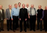 Archbishop Dennis M. Schnurr, center, stands with members of the Ordination Class of 1979, during the Archdiocese of Cincinnati's annual Ordination Anniversasry Dinner at the Bergamo Center in Beavercreek, Ohio on Monday, May 6. Members of the class include: Front L-R Fathers Terry Schneider, Jerry Gardner, Jeff Kemper. Marc Sherlock, Jim Schutte, and Dave Lemkuhl. Back L-R Fathers Larry Tensi and Len Wenke. (CT Photo/David A. Moodie)