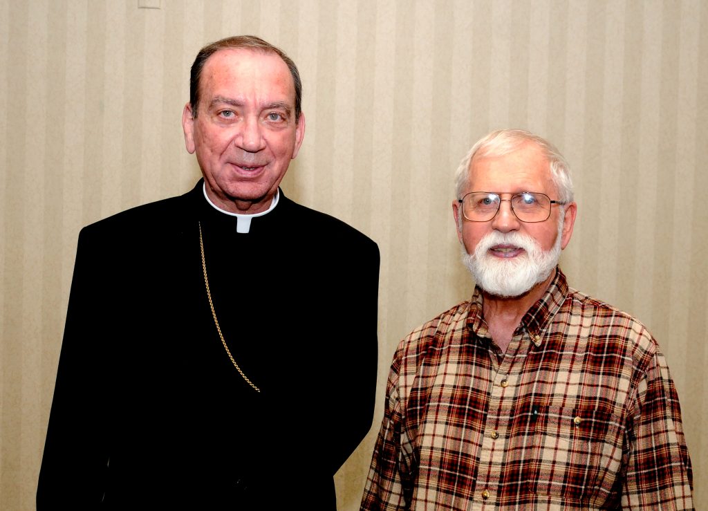 Archbishop Dennis M. Schnurr, left, stands with Ordination Class of 1969 member Father George R Schmitz, during the Archdiocese of Cincinnati's annual Ordination Anniversasry Dinner at the Bergamo Center in Beavercreek, Ohio on Monday, May 6. (CT Photo/Dave Moodie)