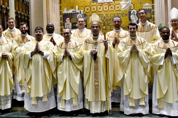 Front Row from L to R Father Anthony Brausch, Father Mark Bredstege, Father Jeff Stegbauer, Archbishop Dennis M. Schnurr, Father Andrew Hess, Father Alex Biryomumeisho; Back Row L to R, Father Ambrose Dobrozsi, Father Elias Mwesigye, Father Zach Cecil, Father Jedidiah Tritle, Father Christian Cone-Lombarte, and Bishop Joseph Binzer (CT Photo/Greg Hartman)