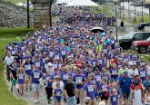 A sea of blue fills the levee during the Cross the Bridge for Life in Newport, Ky. Sunday, June 2, 2019. (CT Photo/E.L. Hubbard)