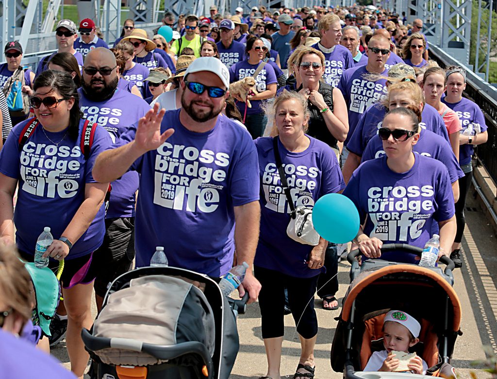People cross the Purple People Bridge during the Cross the Bridge for Life in Newport, Ky. Sunday, June 2, 2019. (CT Photo/E.L. Hubbard)