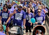 People cross the Purple People Bridge during the Cross the Bridge for Life in Newport, Ky. Sunday, June 2, 2019. (CT Photo/E.L. Hubbard)