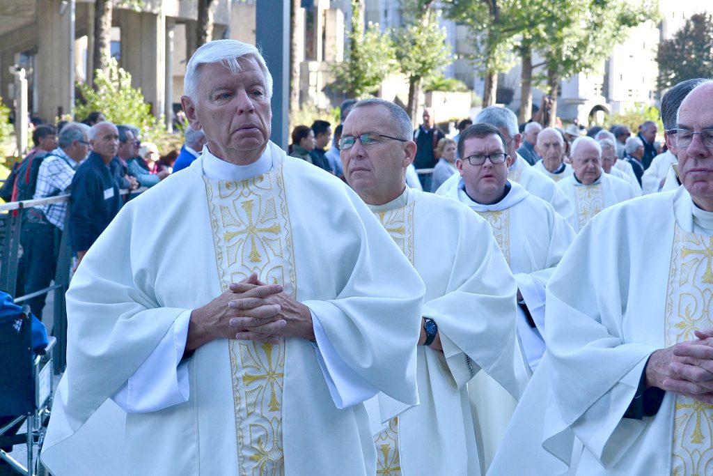 Father David Brinkmoeller during the recessional after Mass at the Grotto in Lourdes on the Marian Pilgramage in 2017.. (CT Photo/Greg Hartman)