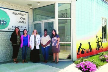 Lori Haskell, Leah Miley, Erin Shock, Jennifer Weddington and Nina Solomon outside Pathway to Hope, a pregnancy care center in Hamilton.