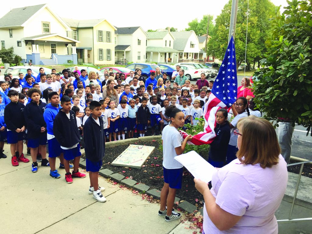 The students at Our Lady of the Rosary School in Dayton came together at the flagpole to remember, honor and pray for all those affected by the September 11 attacks.