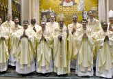 Front Row from L to R: Father Anthony Brausch, Father Mark Bredstege, Father Jeff Stegbauer, Archbishop Dennis M. Schnurr, Father Andrew Hess, Father Alex Biryomumeisho; Back Row L to R, Father Ambrose Dobrozsi, Father Elias Mwesigye, Father Zach Cecil, Father Jedidiah Tritle, Father Christian Cone-Lombarte, and Bishop Joseph Binzer (CT Photo/Greg Hartman)