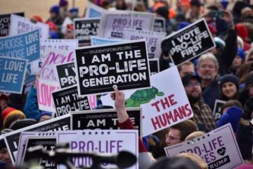 Students and other participants hold signs at the 2020 March for Life in Washington, DC, on Jan. 24, 2020. Credit: Peter Zelasko/CNA