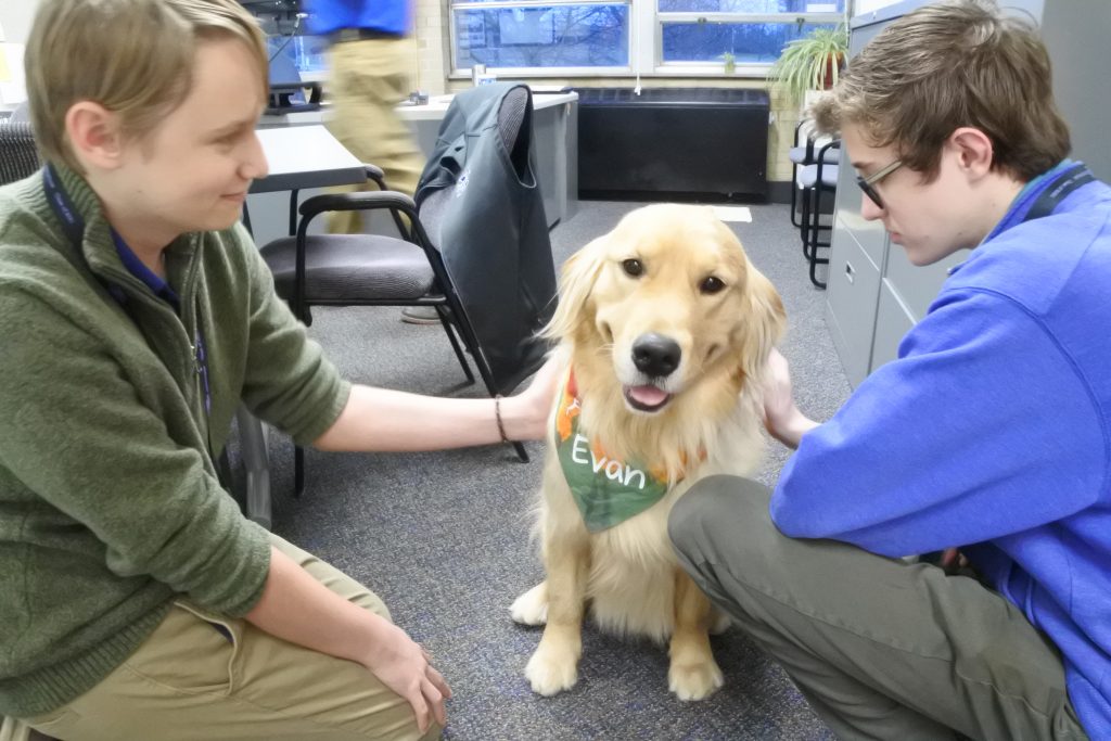 St. Xavier High School is piloting a therapy dog. In partnership with Circle Tail, a nonprofit organization whose mission is to provide service and hearing dogs to people with disabilities, the school will add Evan, a two-year-old Golden Retriever. As part of the pilot, school counselors and the Assistant Principal for Student Services will train as handlers for Evan. Evan is a working dog and conducts himself by a strict set of rules. While his main job is to support students who may be struggling in and around the counselors’ offices, he will also work with the entire school community. He will spend most of his time comforting and assisting students in School Counseling and Educational Services.