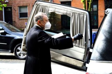 Monsignor Kieran Harrington blesses the coffin of Fr. Jorge Ortiz-Garay before its trip to Mexico. Credit: Diocese of Brooklyn