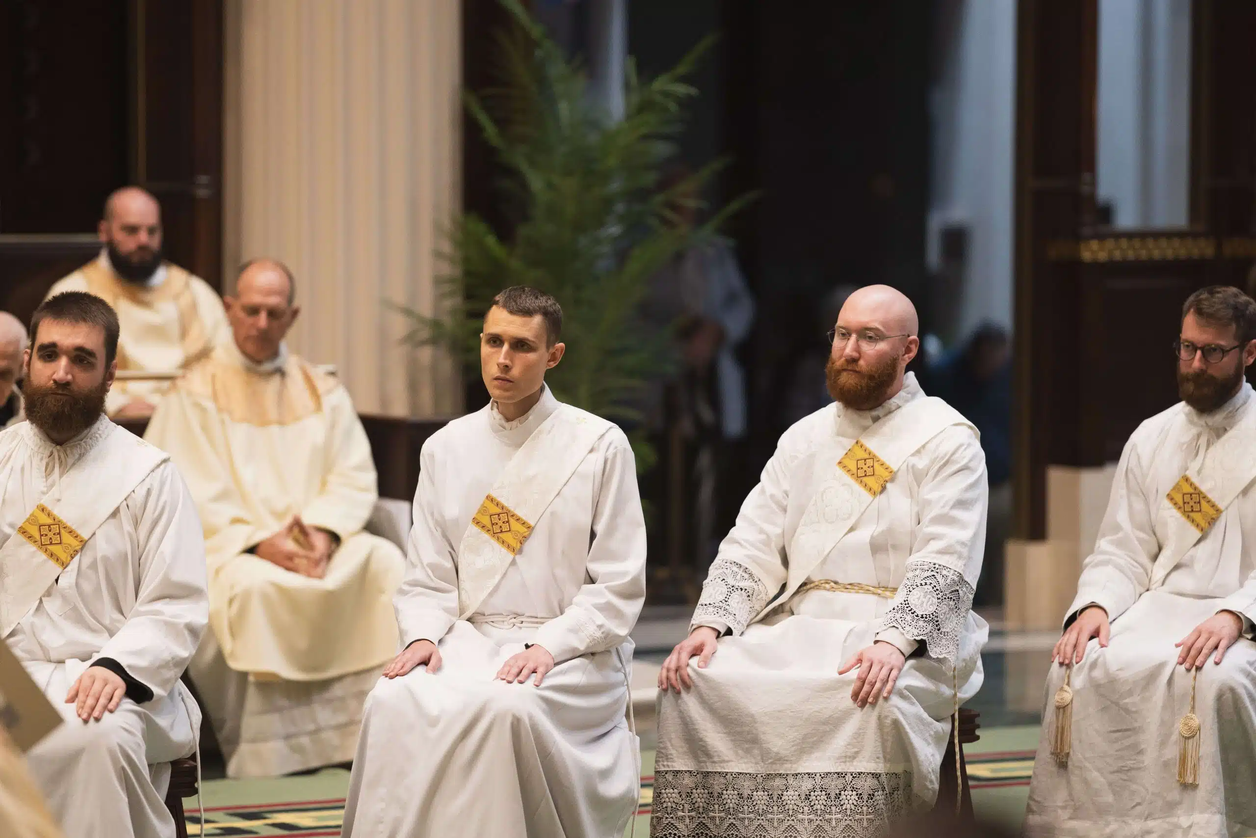 Fr. David Homoelle, Fr. Daniel Jasek, Fr. Nicholas Emmerling, Fr. Benjamin Klare listen to Archbishop Casey's homily