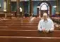 David Cooley, editorial director of The Catholic Telegraph, prays the Rosary at St. Xavier Church