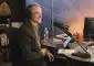 Man smiling with headphones on radio